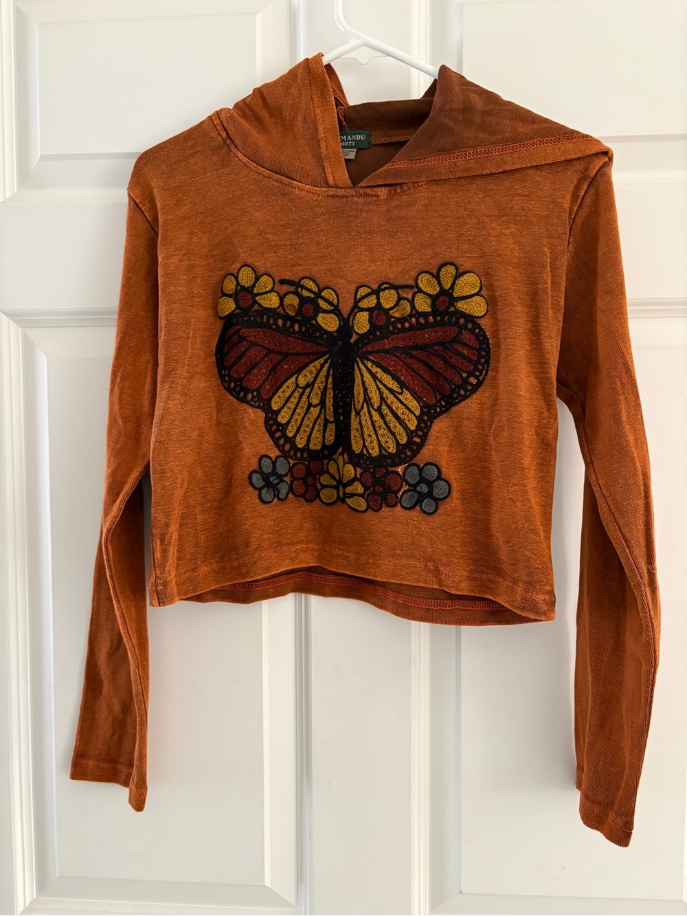 Kathmandu Rust Orange Hoodie with Butterfly Graphic